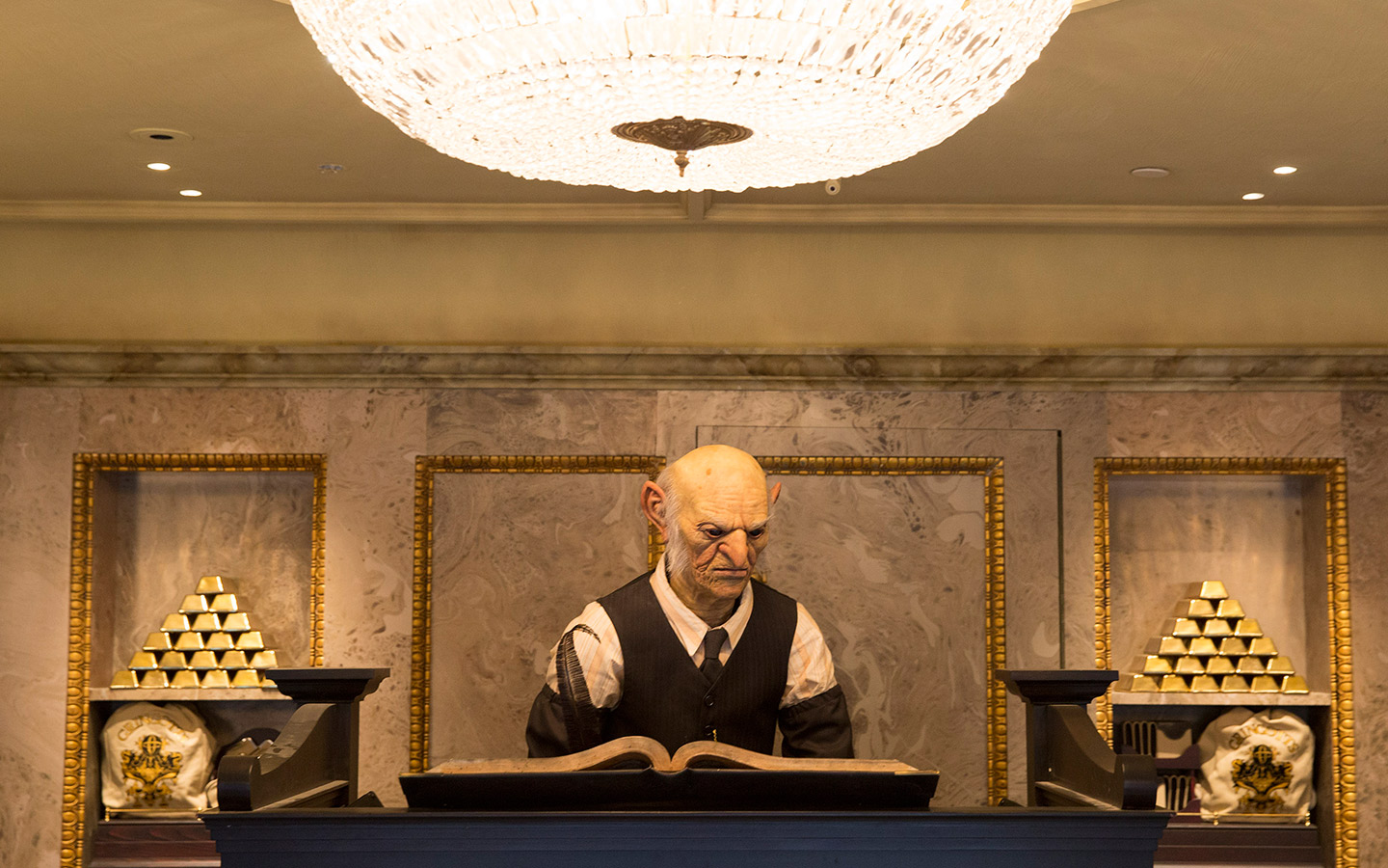 Talk to a golbin at the Gringotts Money Exchange in The Wizarding World of Harry Potter - Diagon Alley