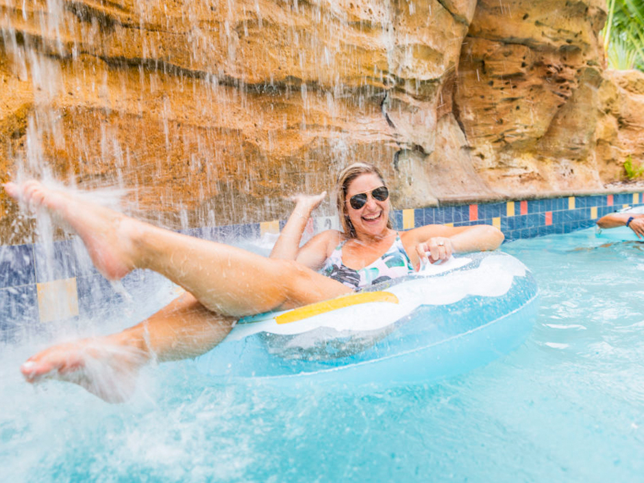Woman in the lazy river at Cabana Bay Beach Resort.