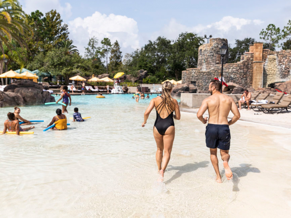 Couple in pool at Loews Portofino Bay Hotel.