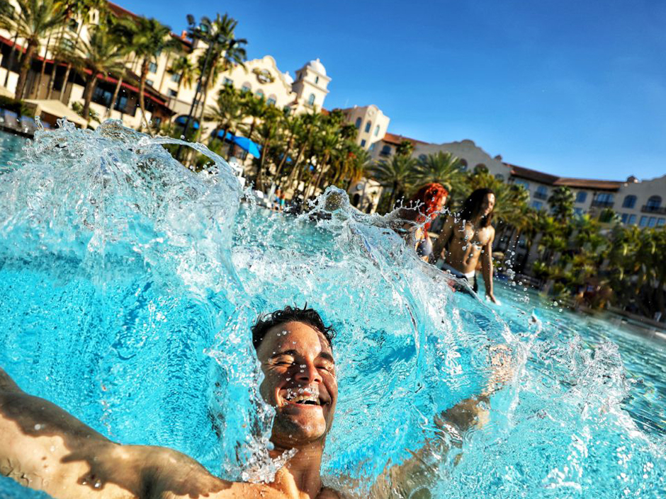 Man jumping into pool at Hard Rock Hotel.