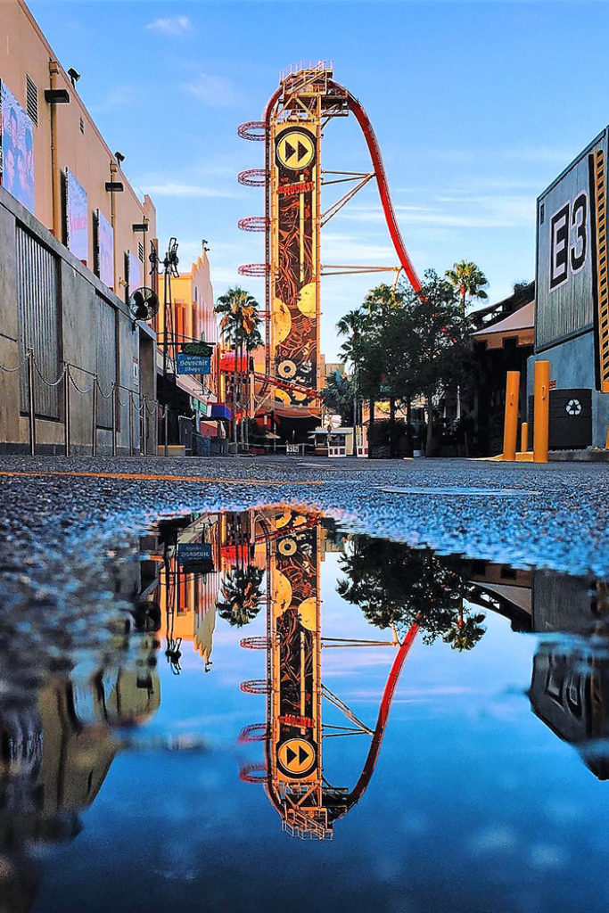 Rip Ride Rockit reflected in a puddle