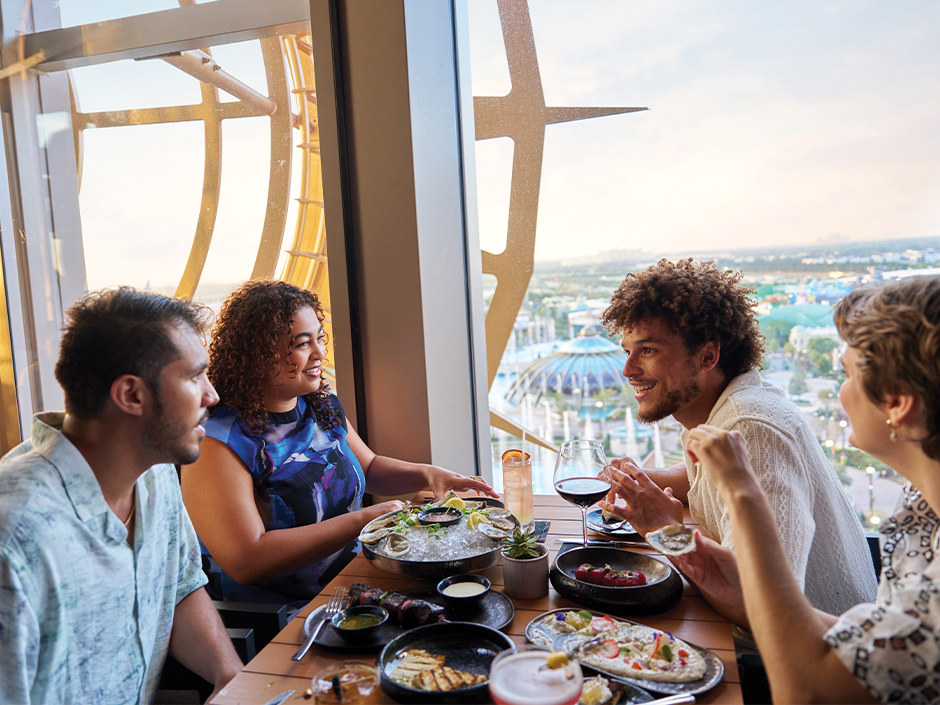 A group of friends dining together at Bar Helios at Helios Grand Hotel.
