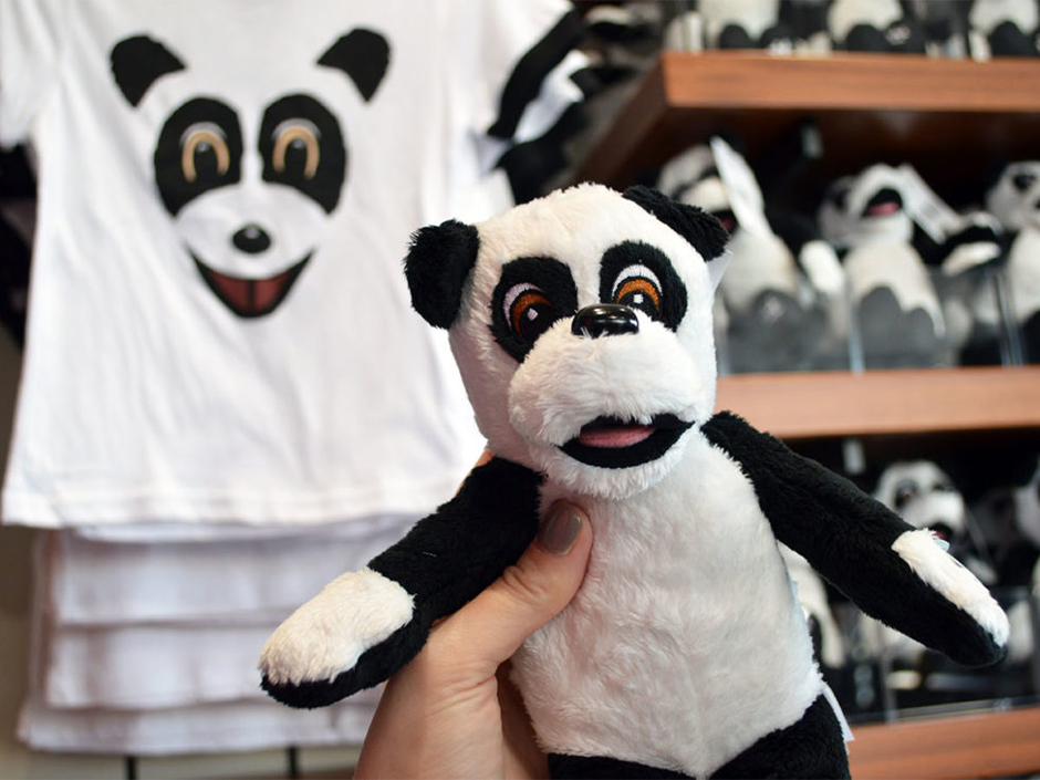 Hashtag Panda plush and merchandise in background