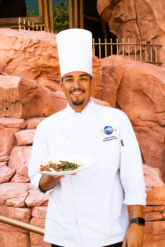 Mythos Chef Justin Jones holding UOAP dish