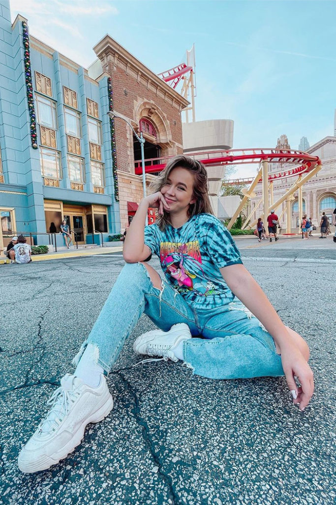 Girl sitting in NY area with RockIt behind