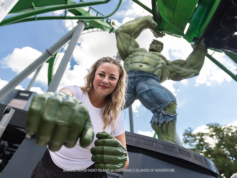 Woman wearing Hulk Fists with Hulk Coaster in Background