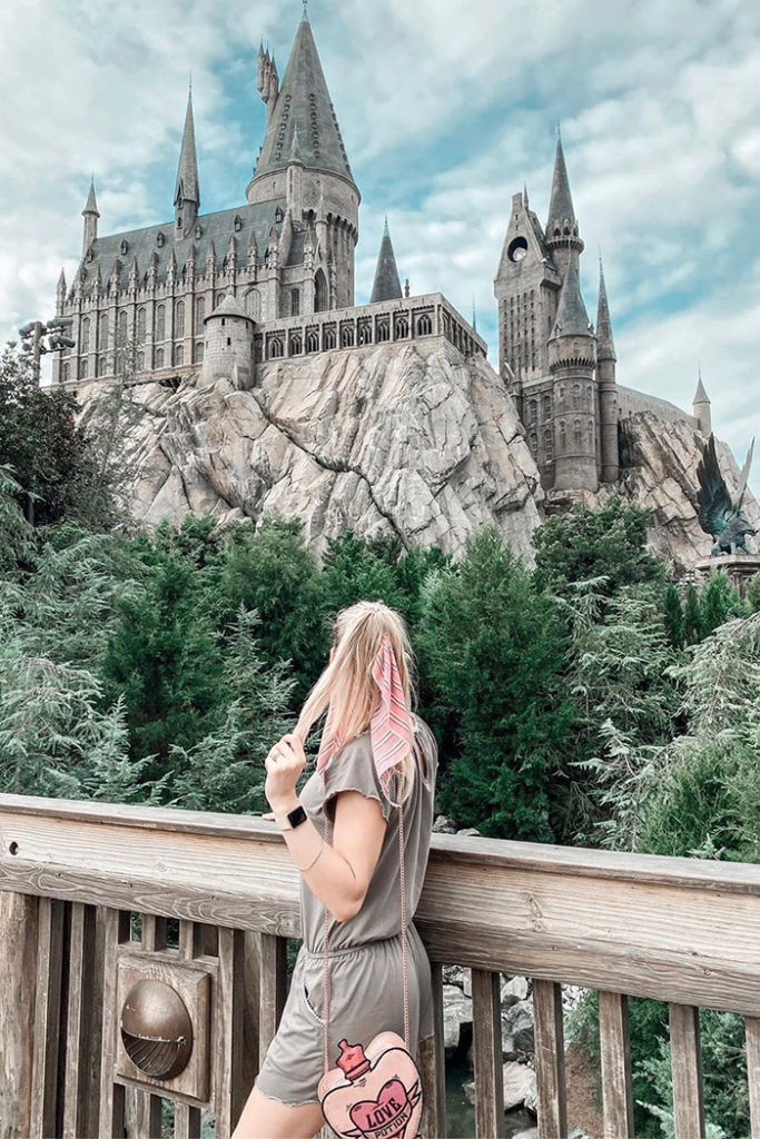 Blonde Woman Looking at Hogwarts Castle from Bridge