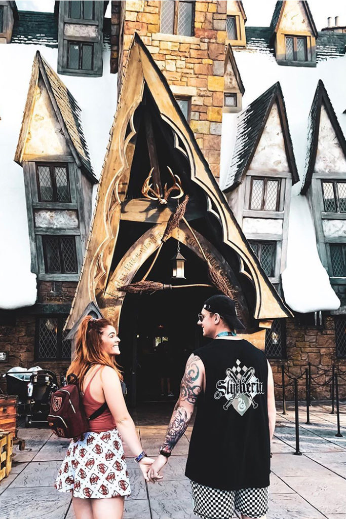 Couple standing in front of Three Broomsticks