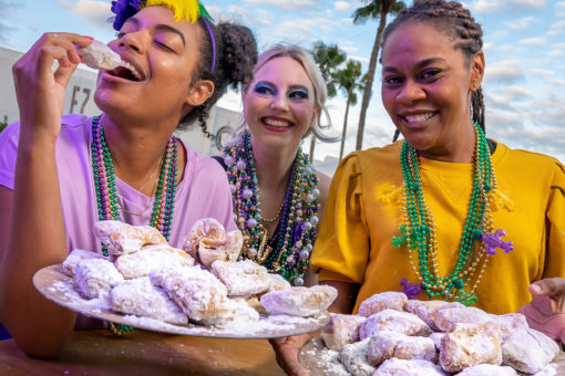 Three women and some beignets at Mardi Gras