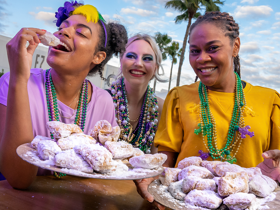 Three women and some beignets at Mardi Gras
