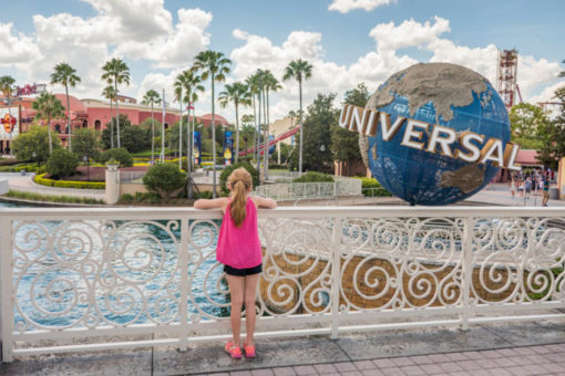 Young girl looking at Universal globe