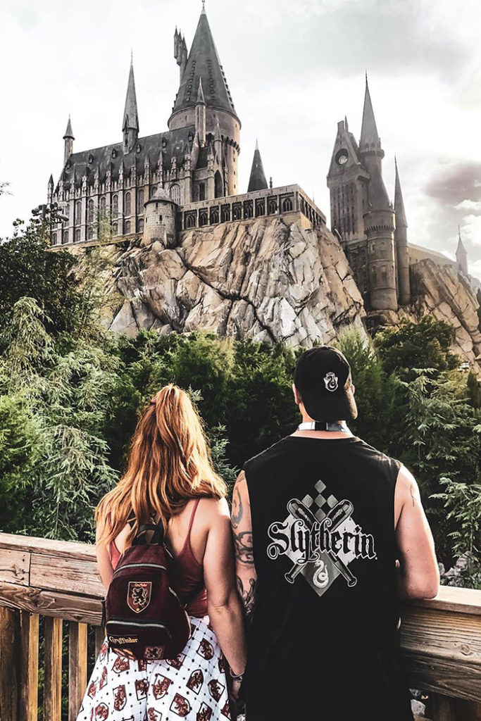Two people in front of Hogwarts Castle