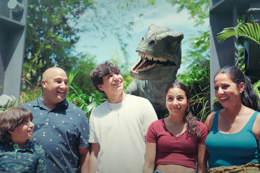 Family with Blue Raptor in the background