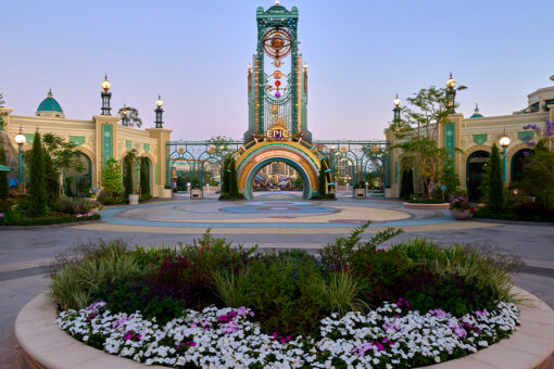 A flower display in front of the Chronos at Universal Epic Universe