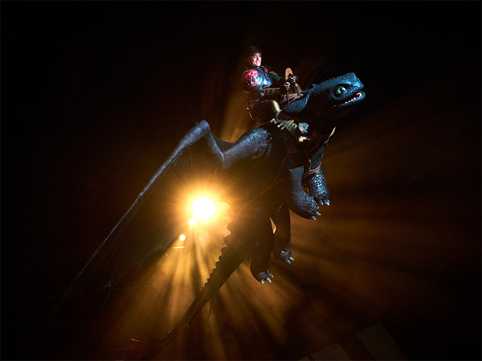 Hiccup and Toothless soaring over the audience in The Untrainable Dragon show at Epic Universe