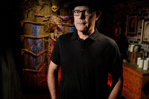 HHN executive director John Murdy standing in haunted house.