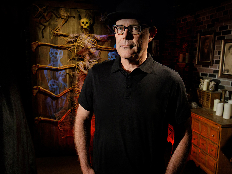 Man standing in haunted house.