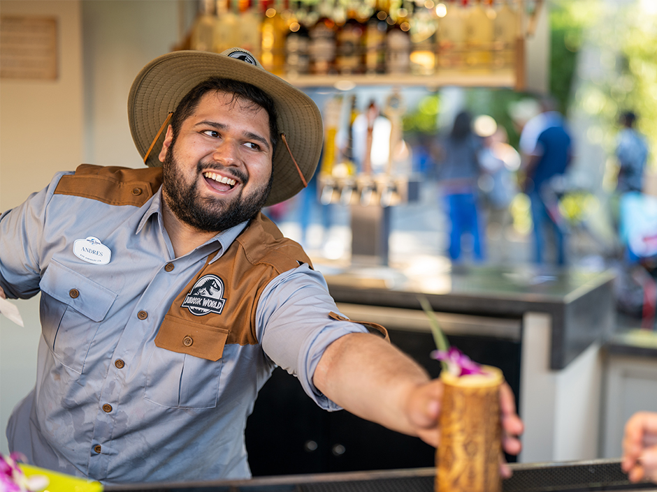 Man serving tiki drink in Jurassic World