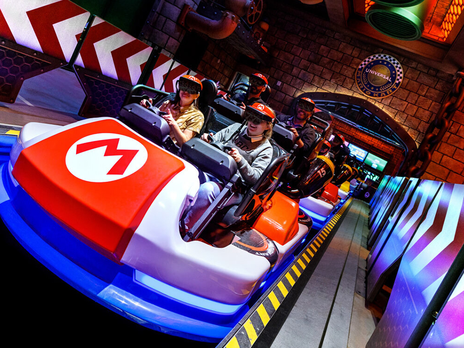 Riders enjoy Mario Kart: Bowser's Challenge at SUPER NINTENDO WORLD. 