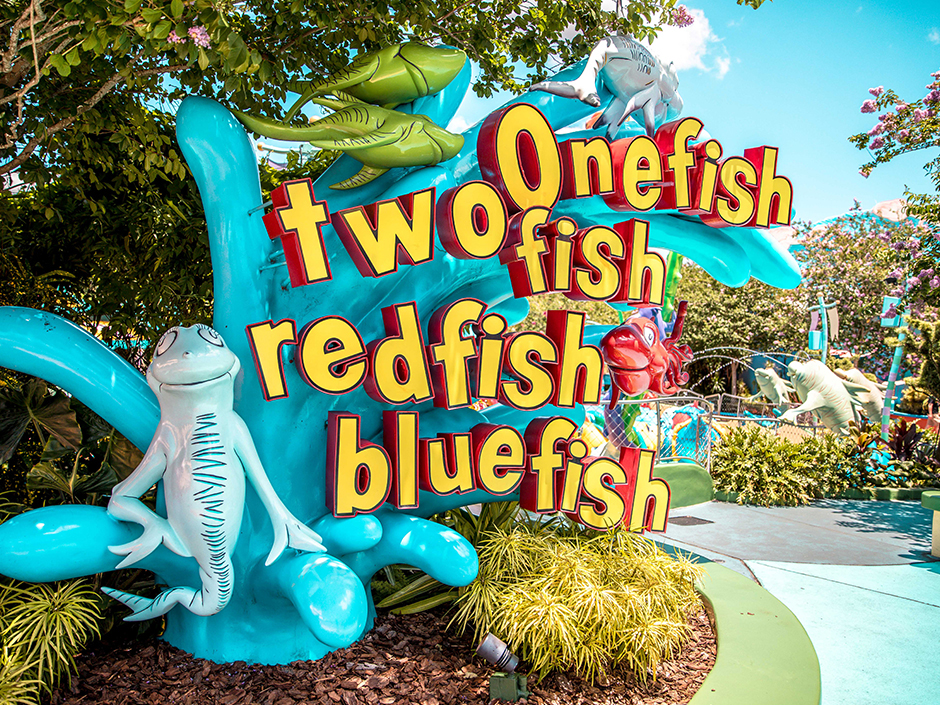 One Fish Two Fish attraction signage with a blue and red fish alongside.