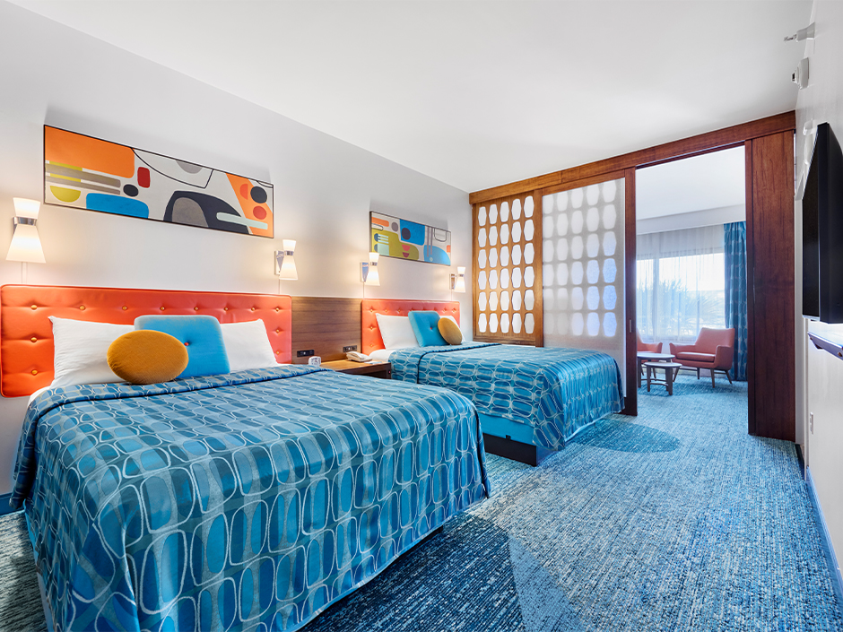 A view of the beds and TV in a family suite at Universal Cabana Bay Beach Resort