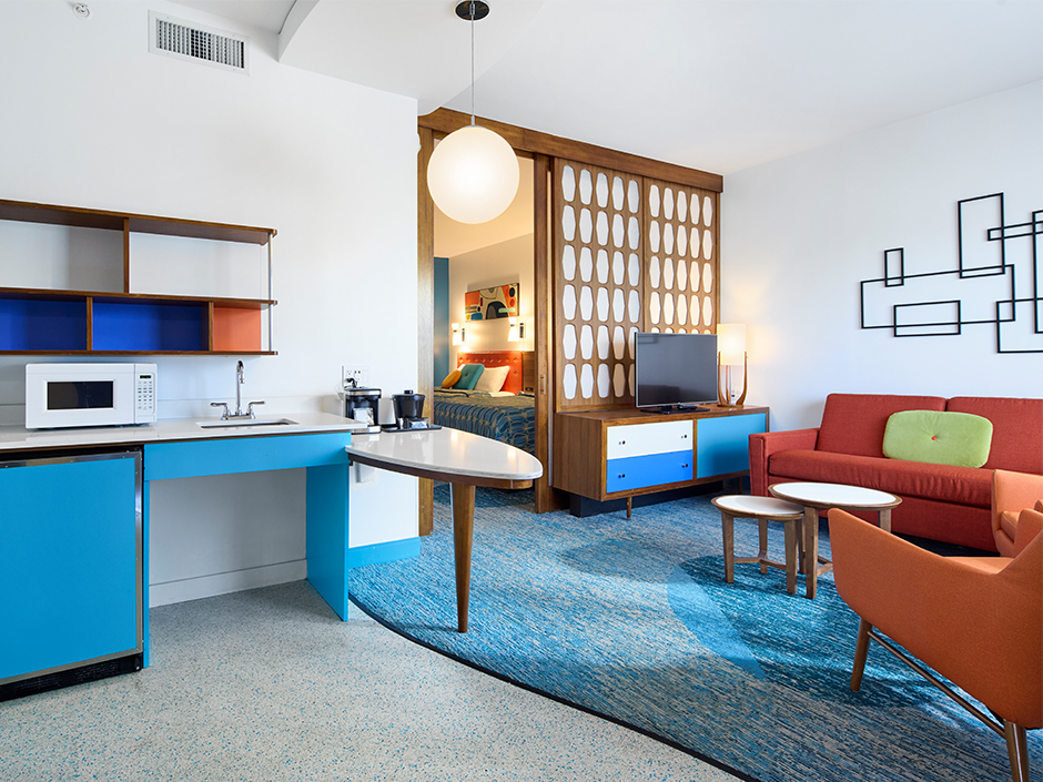 A view of the living room area and kitchenette in a family suite at Universal Cabana Bay Beach Resort