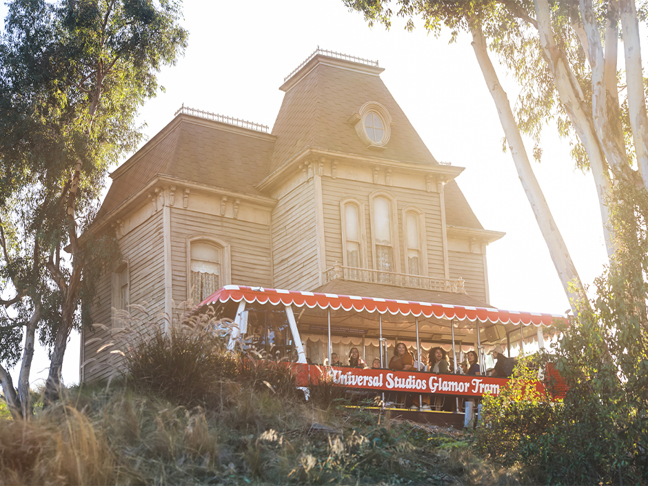 A candy-striped Glamor Tram in front of the Psycho House on the Studio Tour.