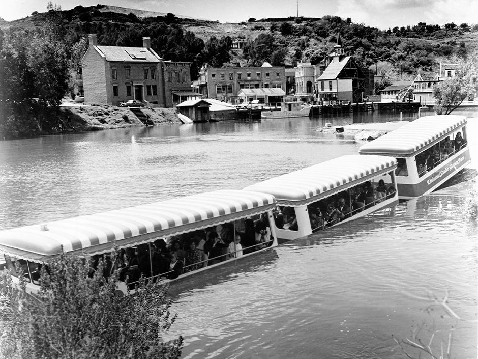 A black and white photo of a Universal Studio Tour tram half-submerged in the "Red Sea" attraction.