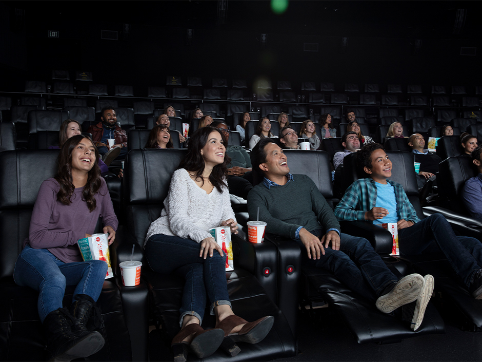 A theater full of guests enjoy a movie at Universal Cinema AMC at Universal CityWalk Hollywood.