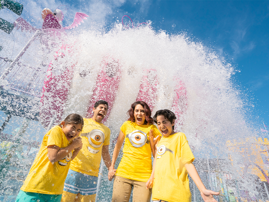 A family of four, all wearing Minions t-shirts, gets splashed at Super Silly Fun Land at Universal Studios Hollywood.