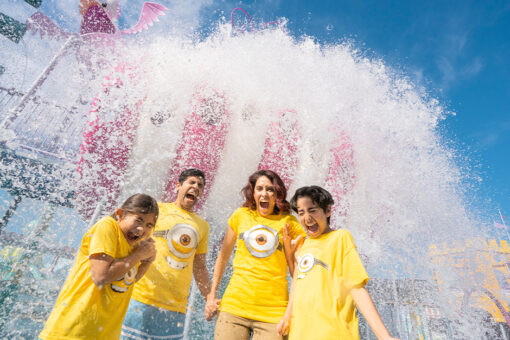 A family of four, all wearing Minions t-shirts, gets splashed at Super Silly Fun Land at Universal Studios Hollywood.
