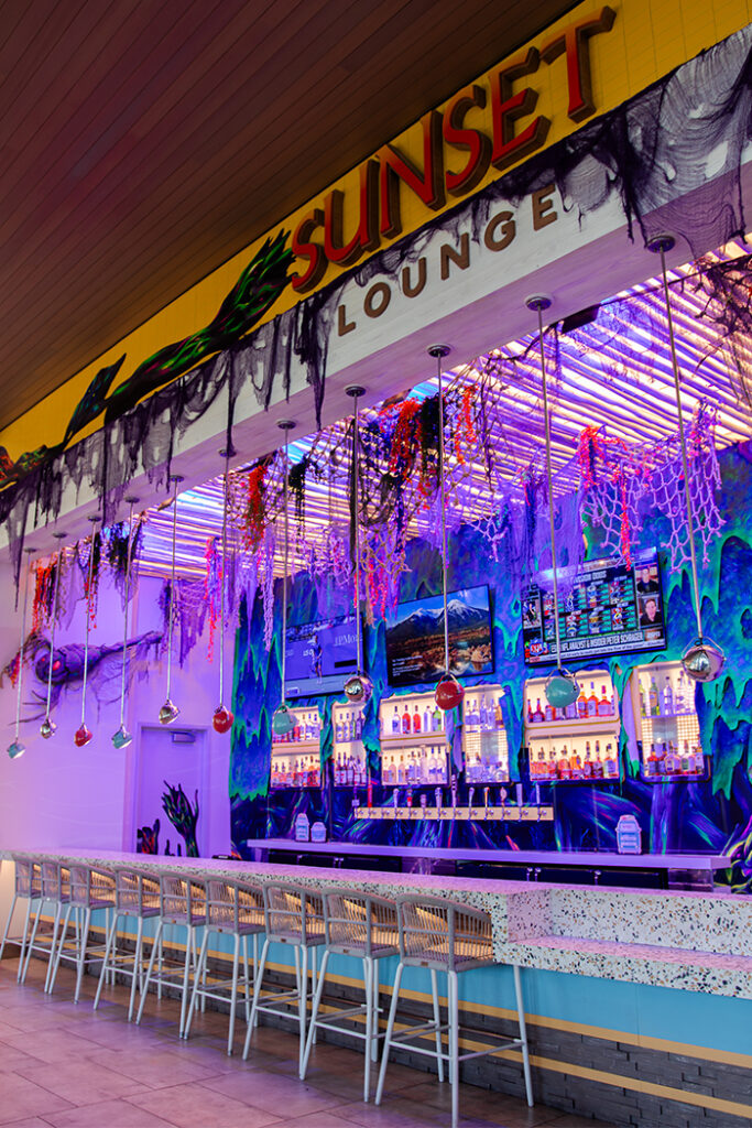 Halloween decor covering the bar front of the Sunset Lounge at Universal Dockside Inn and Suites.