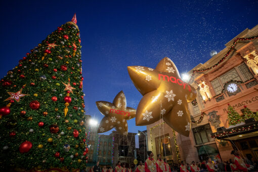 Universal’s Holiday Parade featuring Macy’s passes by the Christmas tree in Universal Studios Florida