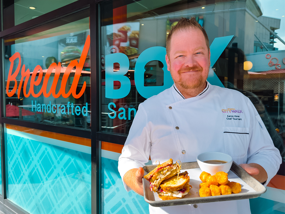 Chef Aaron holds a Holiday Sandwich from Bread Box Handcrafted Sandwiches at Universal CityWalk