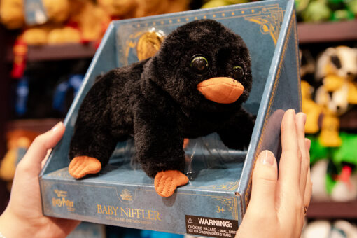 New interactive Baby Niffler plush standing inside its box at Universal Orlando Resort.