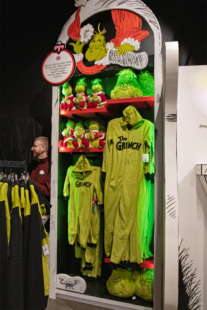 Grinch-themed onesies, plushes and pillows in the How the Grinch Stole Christmas Room.