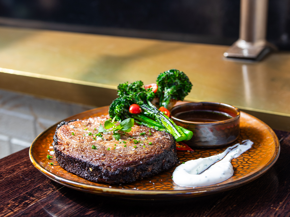 Cocoa crusted prime rib and broccolini at The Toothsome Chocolate Emporium & Savory Feast Kitchen in Universal CityWalk.