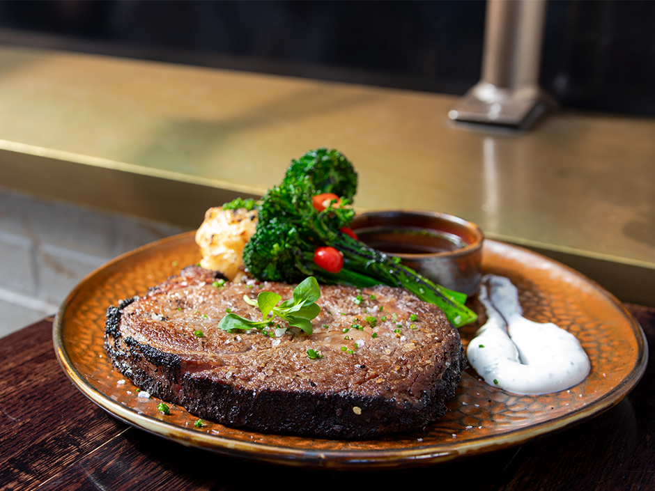 Cocoa crusted prime rib and broccolini at The Toothsome Chocolate Emporium & Savory Feast Kitchen in Universal CityWalk.