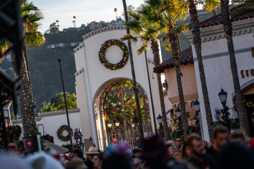 Universal Studios Hollywood arch with holiday decor.