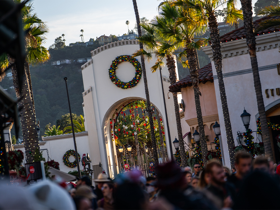 Universal Studios Hollywood arch with holiday decor.