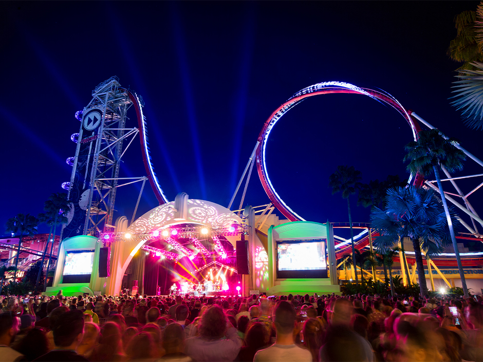 A large crowd enjoys a Universal Mardi Gras concert