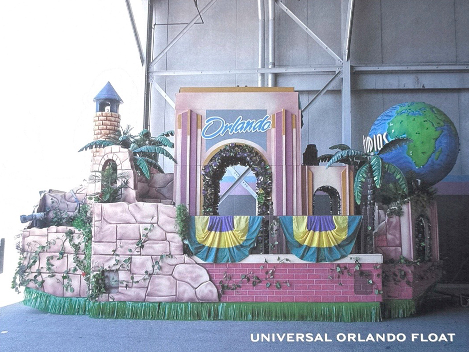 An archival photo of a Universal Mardi Gras Parade float featuring the Universal Studios Florida entry gate and globe