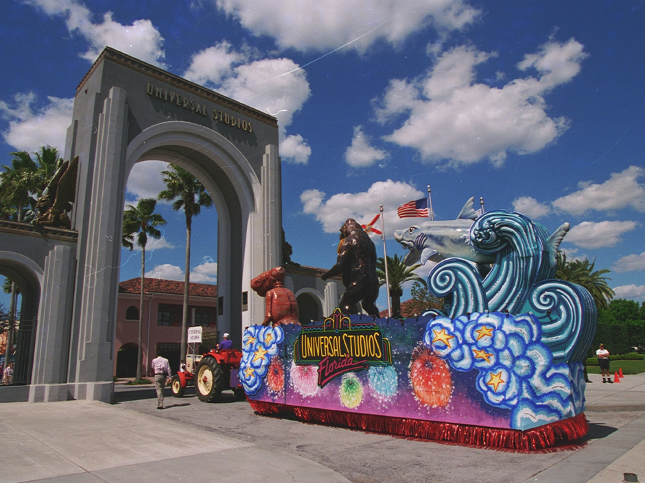 An archival photo of a Universal Mardi Gras Parade float featuring E.T., King Kong, and Jaws