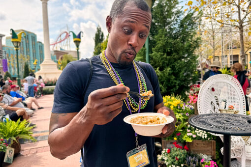 A man enjoying the Cajun Mac and Cheese at Universal Mardi Gras