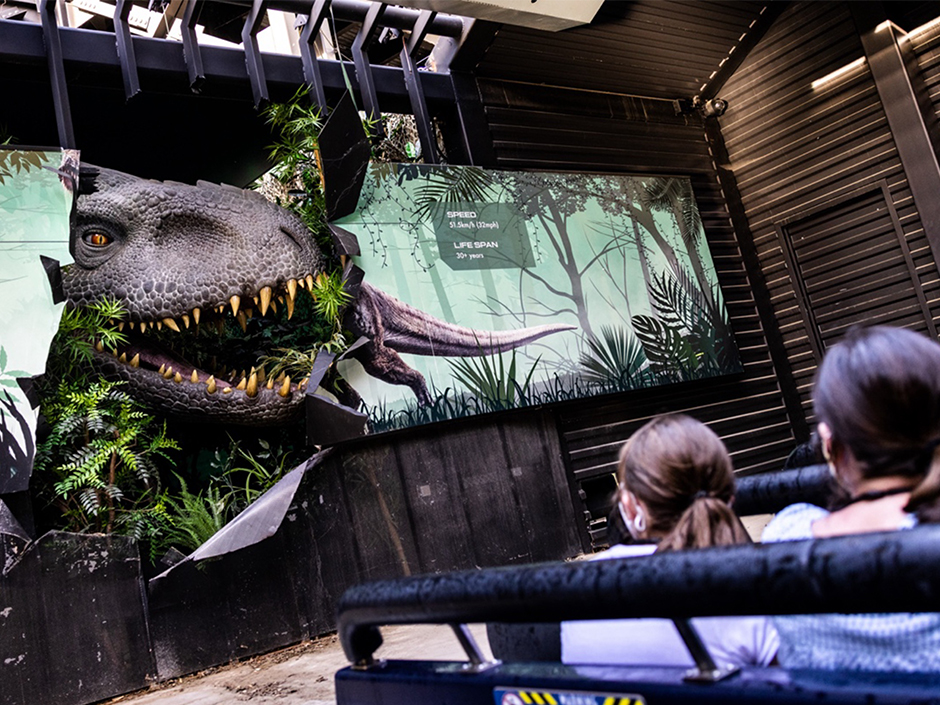 Guests aboard Jurassic World - The Ride.