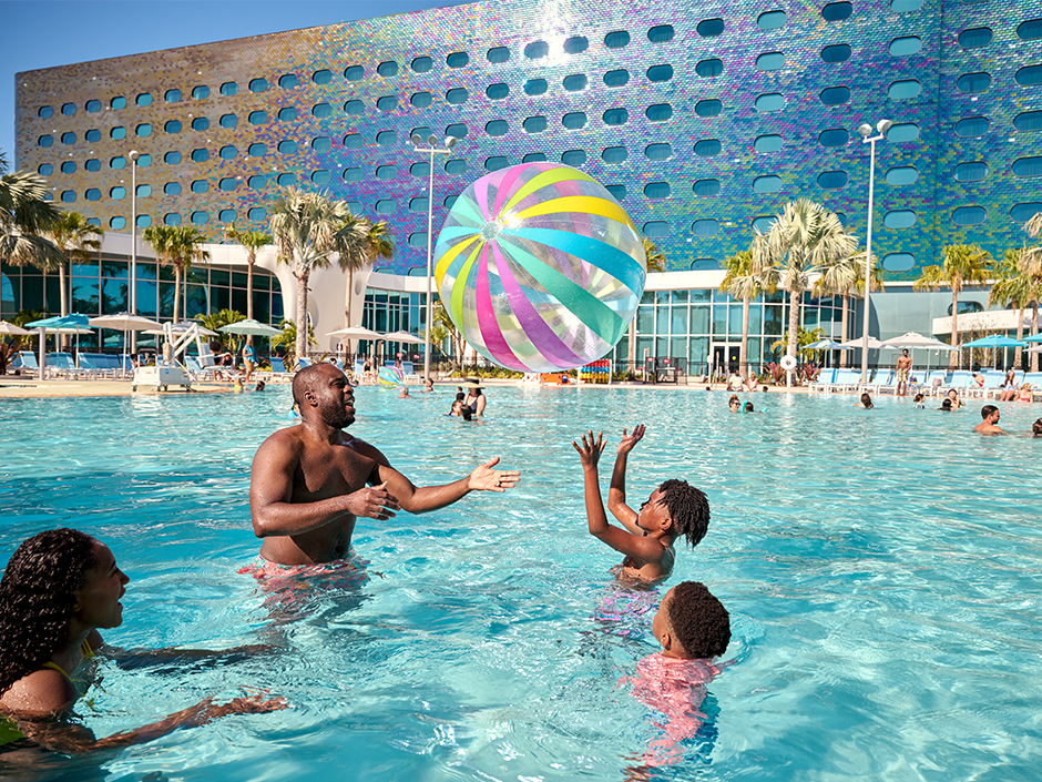 A family plays in the pool at Terra Luna Resort