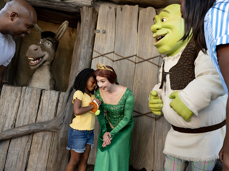A family meets Shrek and Donkey in DreamWorks Land
