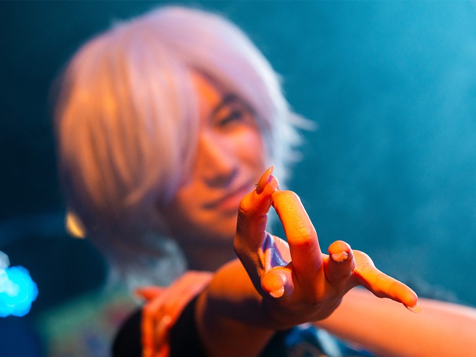 Fan in Jujutsu Kaisen cosplay striking a famous pose from the anime at Universal Fan Fest Nights