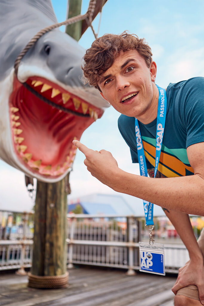 A Universal Passholder poses with the Jaws shark photo op in Universal Studios Florida