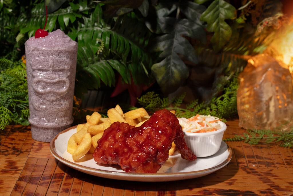 The Evolutionary Wing with a side of fries and slaw and a Jurassic Water Rebirth to drink from Jurassic Cafe at Universal Studios Hollywood